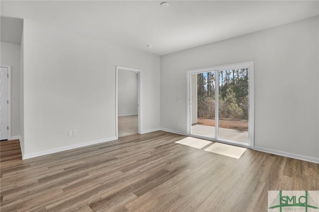 spare room featuring hardwood / wood-style flooring