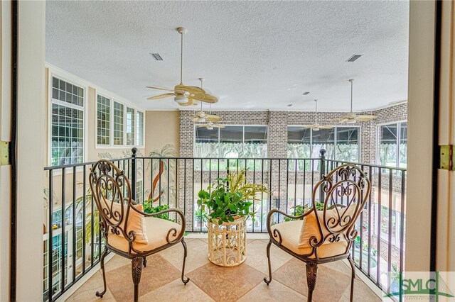 balcony featuring ceiling fan and visible vents