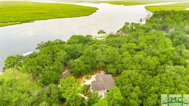 birds eye view of property featuring view of golf course and a water view