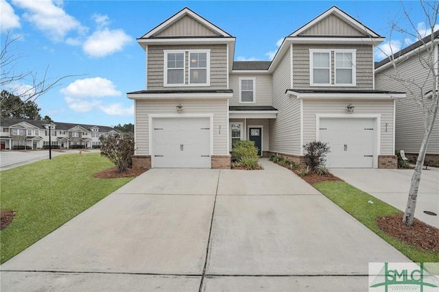 view of front of property with a garage and a front yard