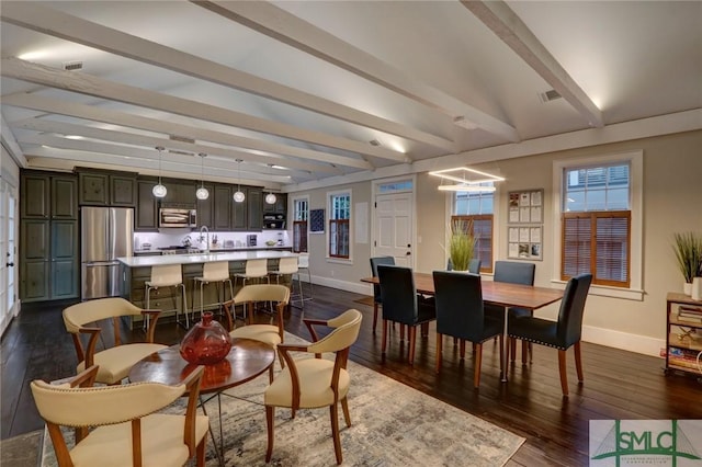 dining space with vaulted ceiling with beams and dark hardwood / wood-style floors