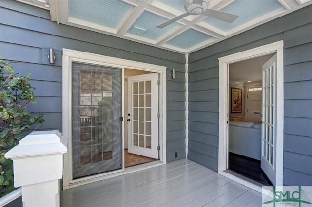 doorway to property with ceiling fan