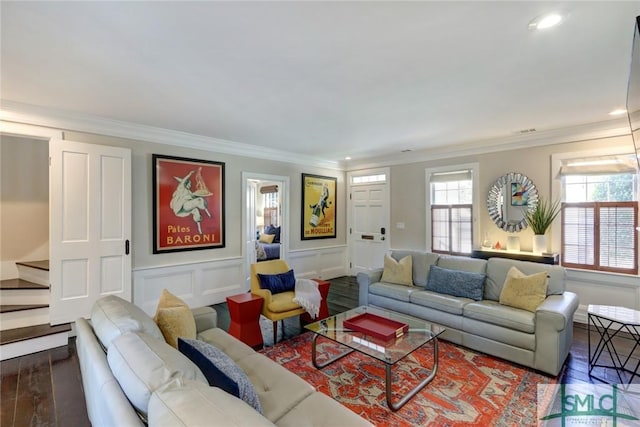 living room featuring dark hardwood / wood-style floors and ornamental molding