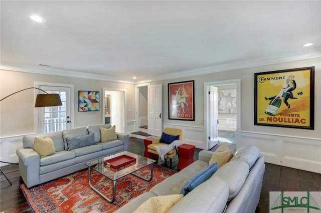 living room with crown molding and dark wood-type flooring