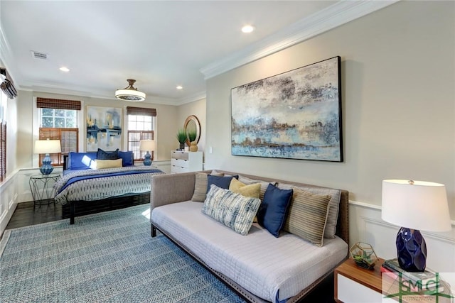 bedroom with ornamental molding, ceiling fan, and hardwood / wood-style floors