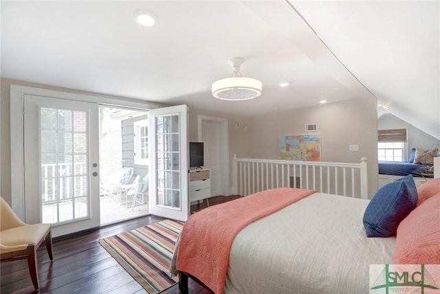 bedroom featuring access to exterior, dark hardwood / wood-style floors, vaulted ceiling, and french doors