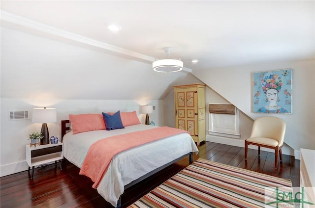 bedroom with dark hardwood / wood-style floors and lofted ceiling