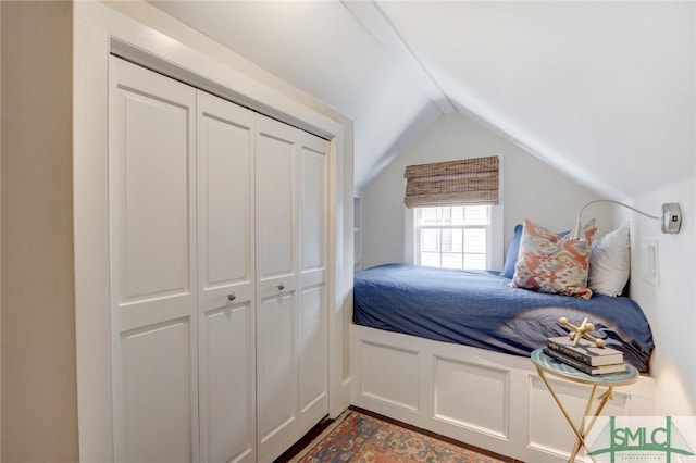 bedroom with a closet and vaulted ceiling