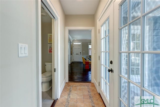 hallway with light tile patterned flooring