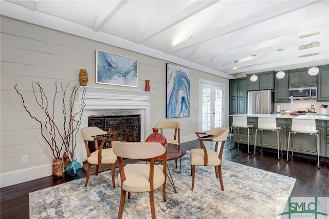 living area with dark wood-type flooring and french doors