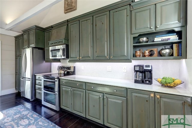 kitchen featuring stainless steel appliances, green cabinets, and dark wood-type flooring