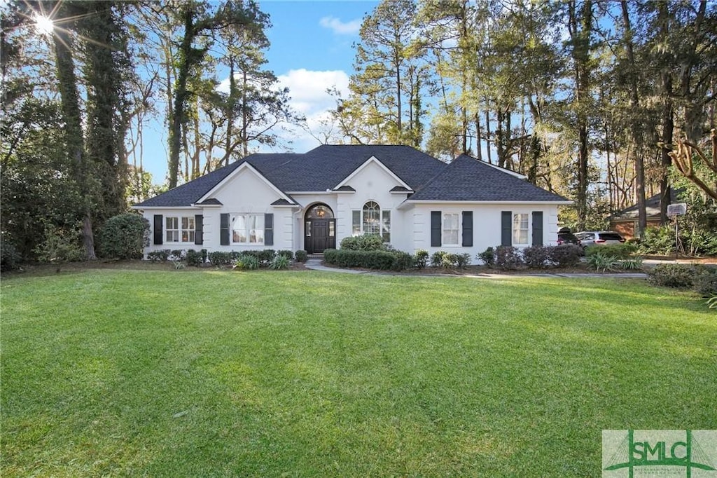 ranch-style house with a front lawn