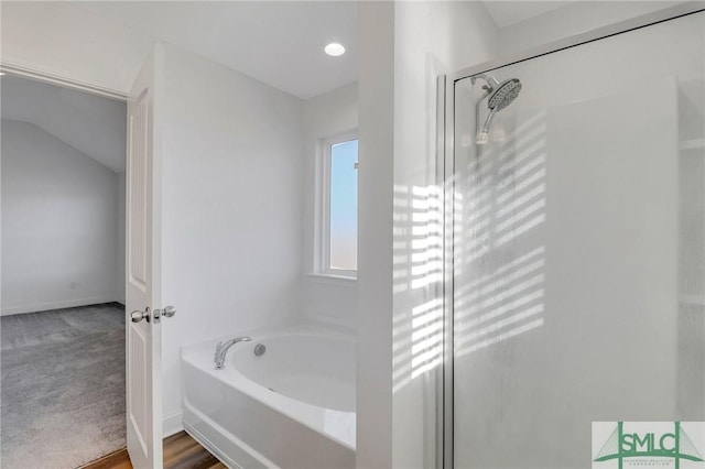 bathroom with shower with separate bathtub