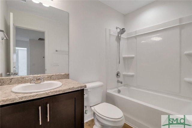 full bathroom with vanity, toilet, and shower / bathtub combination