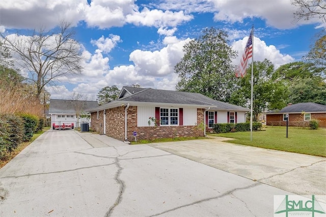 single story home featuring a front yard, central AC, and a garage