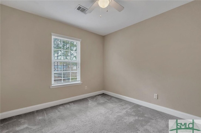 empty room featuring carpet floors and ceiling fan