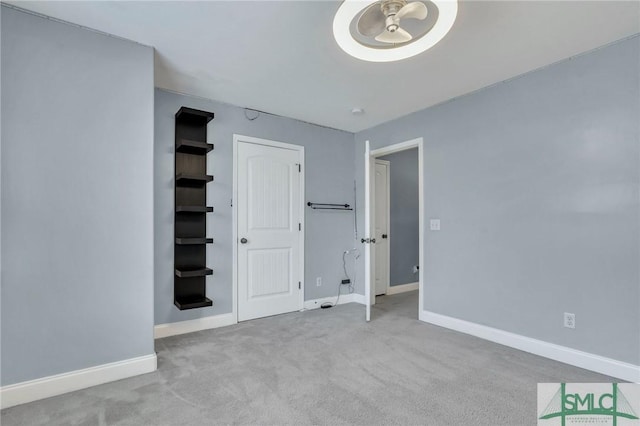 unfurnished bedroom with light carpet