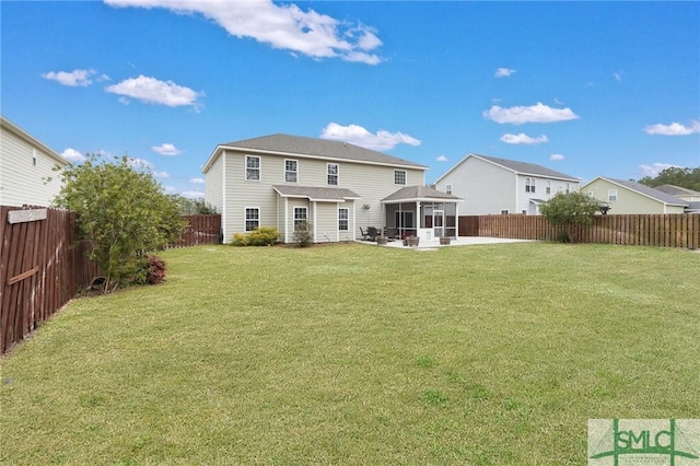 back of property featuring a patio area and a lawn