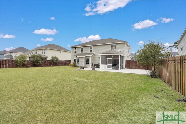 back of property featuring a patio, a yard, and a sunroom