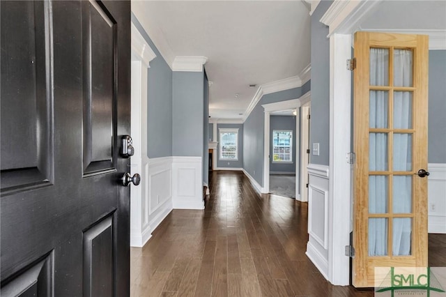 entryway featuring dark hardwood / wood-style flooring and crown molding