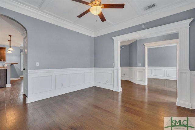 unfurnished room with ornate columns, coffered ceiling, ornamental molding, dark wood-type flooring, and ceiling fan