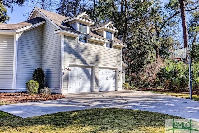 view of side of home featuring a garage