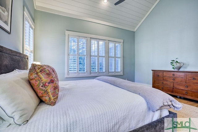 bedroom featuring multiple windows, hardwood / wood-style floors, wood ceiling, and vaulted ceiling