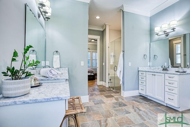 bathroom with crown molding, vanity, and walk in shower