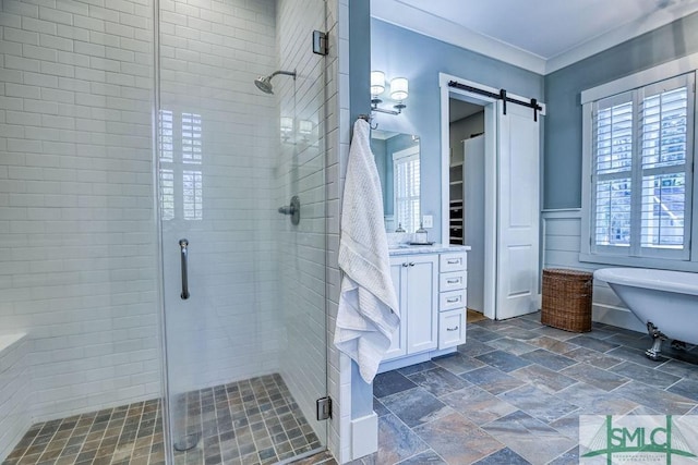 bathroom with crown molding, vanity, and separate shower and tub