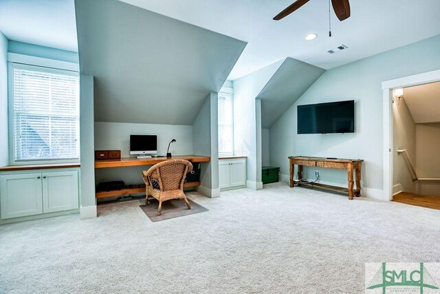 office with ceiling fan, vaulted ceiling, and light carpet