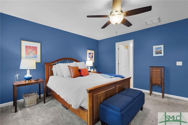 bedroom featuring ceiling fan and light carpet