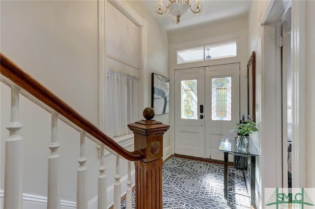 entrance foyer featuring an inviting chandelier