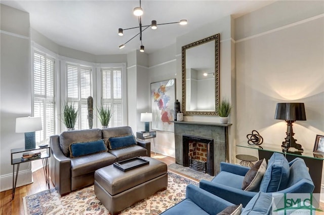 living room featuring hardwood / wood-style floors and an inviting chandelier