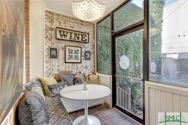 sunroom with an inviting chandelier