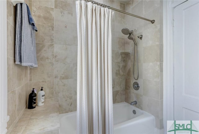 bathroom with shower / bath combination with curtain