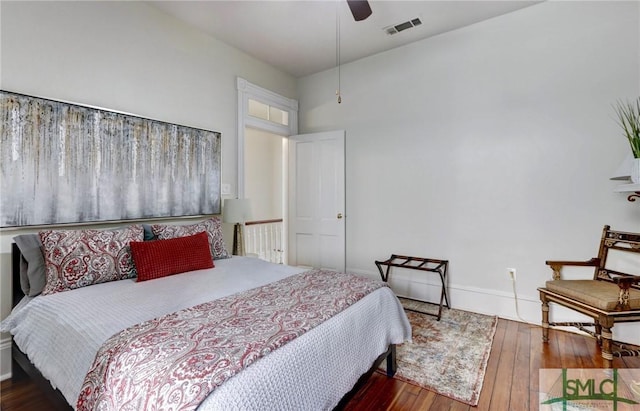 bedroom featuring ceiling fan and dark hardwood / wood-style flooring