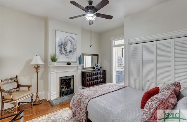 bedroom featuring a closet, ceiling fan, and hardwood / wood-style floors