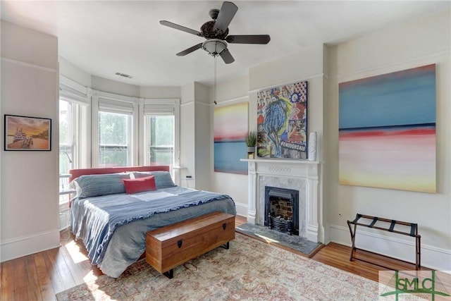 bedroom featuring ceiling fan and light hardwood / wood-style flooring