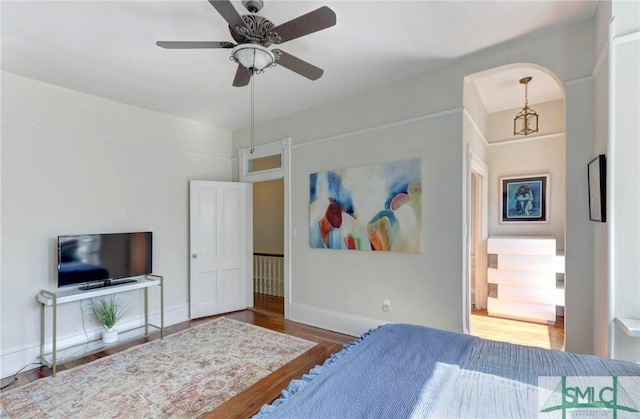 bedroom with hardwood / wood-style flooring and ceiling fan