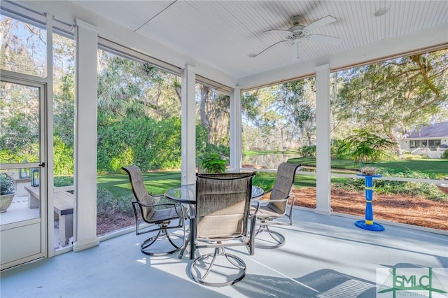 sunroom / solarium with ceiling fan