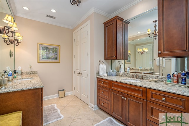 bathroom with vanity, a chandelier, ornamental molding, and tile patterned flooring