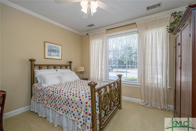 carpeted bedroom with crown molding and ceiling fan