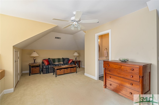 living area with ceiling fan, light carpet, and lofted ceiling