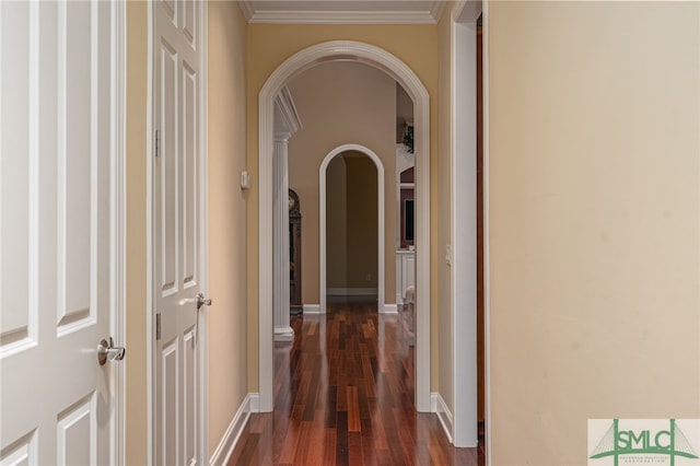 hall with crown molding and dark hardwood / wood-style flooring