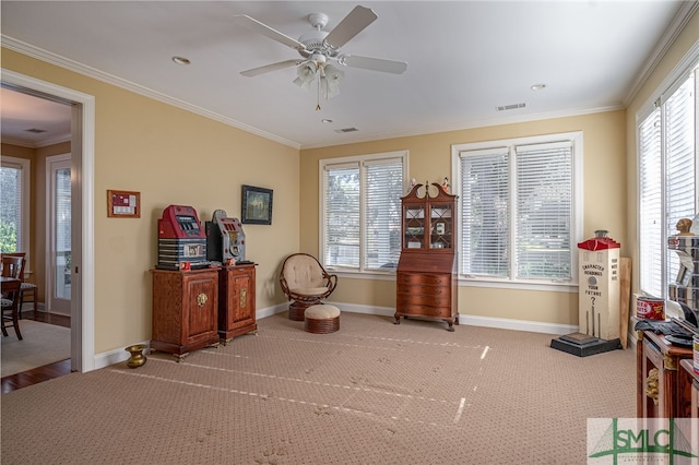 miscellaneous room with crown molding, carpet flooring, and ceiling fan