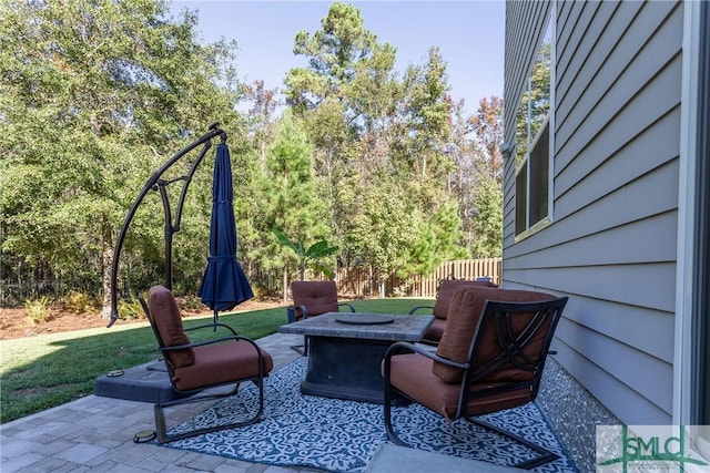 view of patio / terrace featuring a fire pit