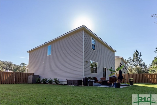 back of property featuring cooling unit, a patio, and a lawn