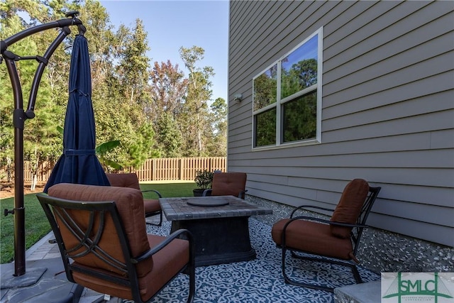 view of patio with a fire pit