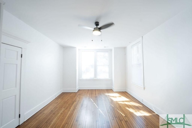 empty room featuring ceiling fan and wood-type flooring