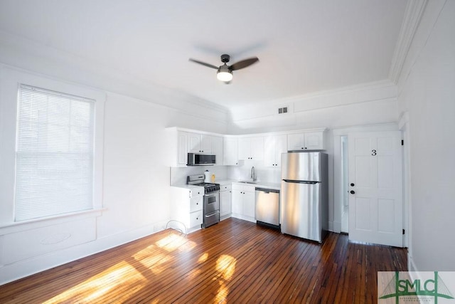 kitchen featuring ceiling fan, dark hardwood / wood-style flooring, sink, appliances with stainless steel finishes, and white cabinets